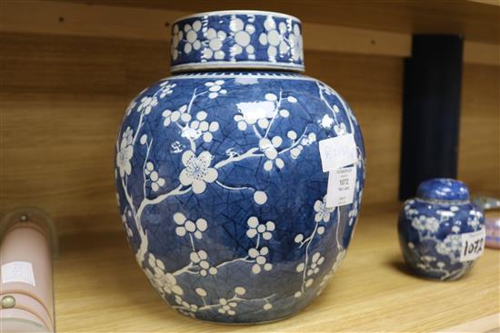 A large Chinese prunus jar and cover and another small jar
